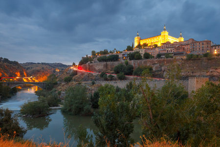 Old city of Toledo with Alcazar and river Tajo at night, Castilla La Mancha, Spain