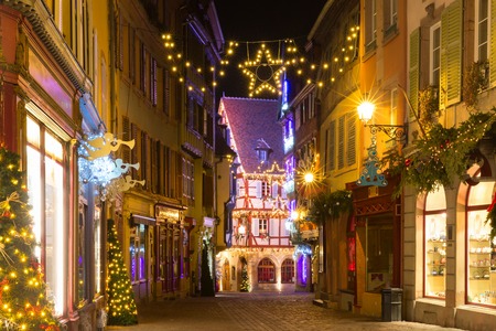Traditional Alsatian half-timbered houses in old town of Colmar, decorated and illuminated at christmas time, Alsace, Franceの写真素材
