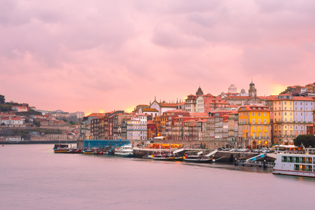 Ribeira and Old town of Porto with mirror reflections in the Douro River at sunset, Portugal, Portugal.の写真素材