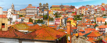 Aerial panoramic view with traditional multicolored quaint houses in Old town of Porto in the sunny...