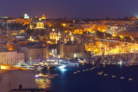 Aerial skyline view of Birgu - one of Three cities, as seen from Valletta at night, Malta.の写真素材