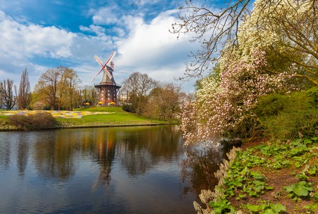 Popular city park Wallanlagen with Am Wall Windmill and river in Bremen, Germanyの写真素材
