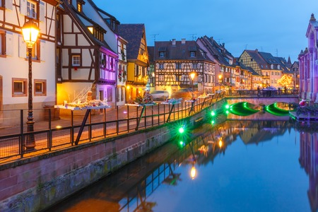 Traditional Alsatian half-timbered houses and river Lauch in Petite Venise or little Venice, old town of Colmar, decorated and illuminated at christmas time, Alsace, Franceの写真素材