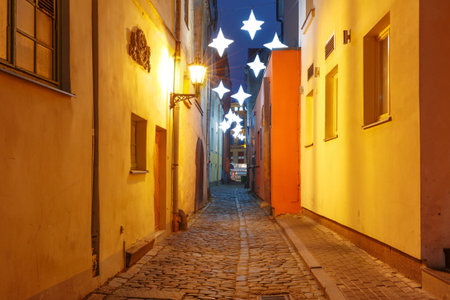 Decorated and illuminated Christmas street of Old Town at night, Riga, Latviaの写真素材