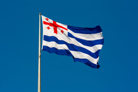 Large waving flag autonomous republic of Adjara against the blue sky, Batumi, Adjara, Georgia