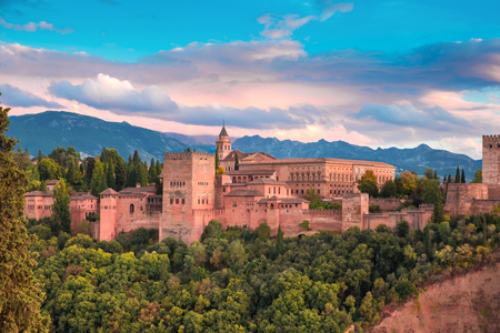Palace and fortress complex Alhambra with Comares Tower, Palacios Nazaries and Palace of Charles V during sunset in Granada, Andalusia, Spainの写真素材