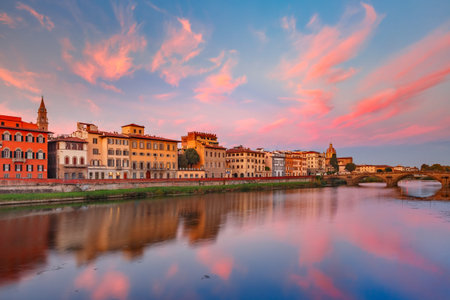 River Arno and famous bridge Ponte Vecchio at gorgeous sunrise in Florence, Tuscany, Italyの写真素材