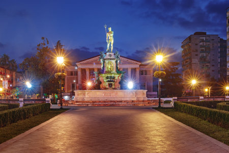 Neptune Monument and Ilya Chavchavadze State Drama Theatre during blue hour in Batumi, Adjara, Georgiaの写真素材
