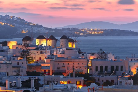 Famous view, Traditional windmills on the island Mykonos, The island of the winds, at sunset, Greeceの写真素材