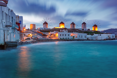 Famous view, Traditional windmills on the island Mykonos, The island of the winds, at cloudy sunrise, Greeceの写真素材