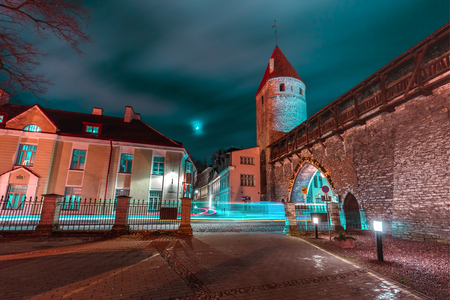 Defensive tower of the Tallinn city wall Nunnatorn and Monastery Gate in Medieval Old Town at night, Tallinn, Estoniaの写真素材