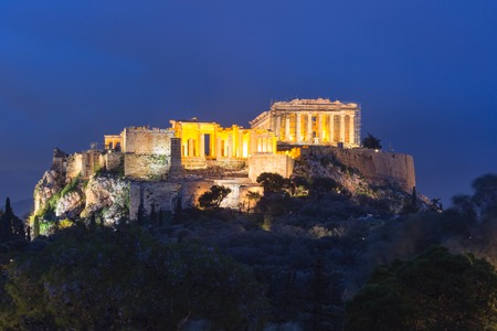 Acropolis Hill, crowned with Parthenon during evening blue hour in Athens, Greeceの写真素材