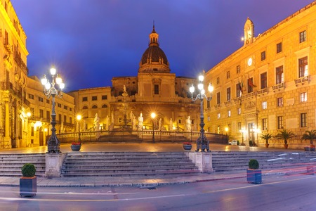 The Praetorian Fountain with church of Santa Caterina in the background on Piazza Pretoria, also known as square of Shame, Palermo at night, Sicily, Italyの写真素材
