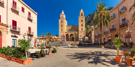 Panoramic vew of Cathedral-Basilica of Cefalu or Duomo di Cefalu and square Piazza del Duomo in the old town of coastal city Cefalu, Sicily, Italyの写真素材