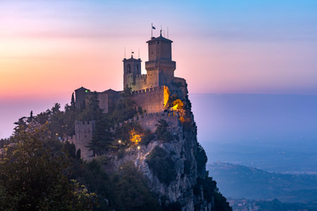 Guaita fortress or Prima Torre on the ridge of Mount Titano, in the city of San Marino of the Republic of San Marino at sunsetの写真素材