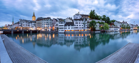 Panorama of Zurich Old town with famous Fraumunster, St Peter churches and river Limmat during...