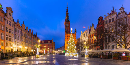 Panorama of Christmas tree and illumination on Long Market Street and Town Hall at night in Old Town...