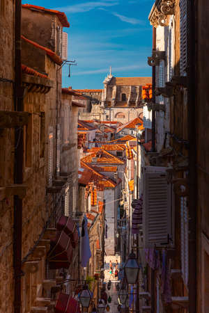 Medieval street with stairs in famous european city of Dubrovnik on a sunny day.の写真素材