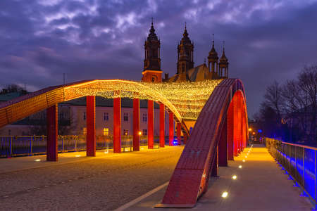 The Bishop Jordan Bridge over Cybina River and Poznan Cathedral at gorgeous sunset, Poznan, Poland.の写真素材