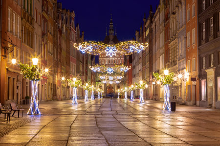 Golden gate of Long market decorated with Christmas illuminations at night, Gdansk, Poland.