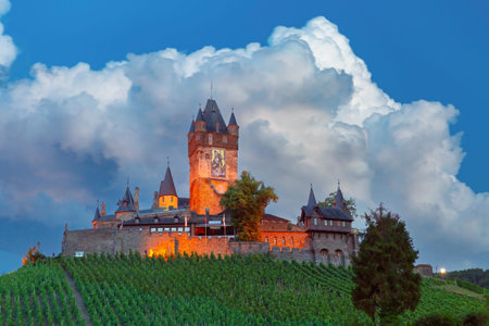Cochem at sunset, beautiful town on romantic Moselle river, Reichsburg castle on hill, Germany
