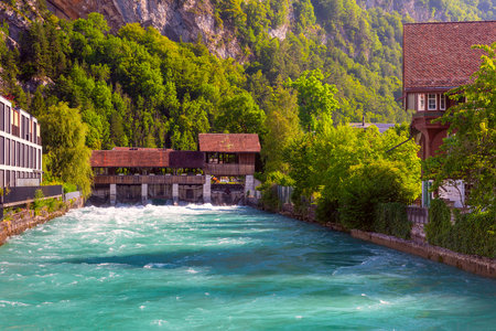 Old weir on Aare river in Old City of Unterseen, Interlaken, Switzerlandの写真素材