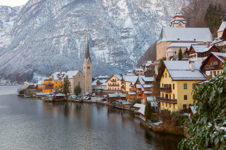 Winter Hallstatt village with snowy mountains and traditional houses, Austria
