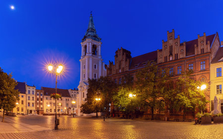 View of Town Hall Square with the old medieval Town Hall illuminated by lanterns in the blue hour...