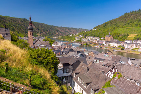 Picturesque view of the old town of Cochem with traditional half-timbered houses, church tower and the Moselle river, Germany.の写真素材