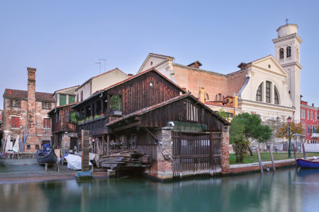 Traditional gondola repair workshop by the canal near San Trovaso Church in Venice, Italyの写真素材