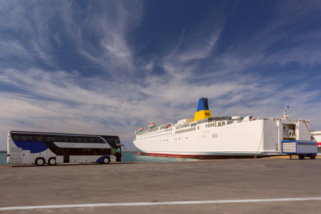 Docked ferry and tourist bus at Heraklion port in Heraklion Greeceの写真素材