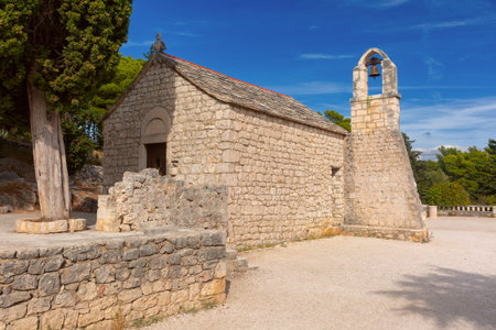 Stone Church of Saint Nicholas in Split Croatia with bell tower and traditional Dalmatian...