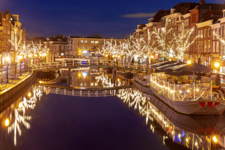 Holiday Christmas illumination along canal in historic center of Leiden, Netherlandsの写真素材