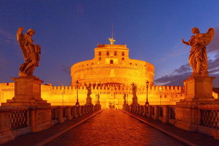 Castel Sant Angelo and angel statues on Ponte Sant Angelo at sunrise in Rome, Italyの写真素材