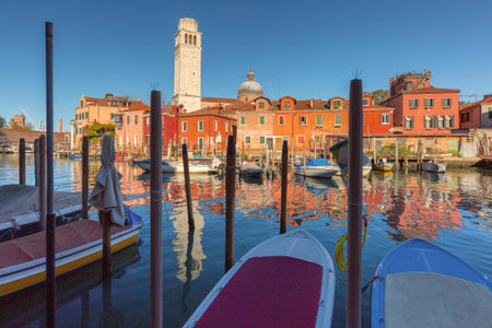 Colorful waterfront with boats in Venice, Italyの写真素材