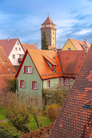 Historic watchtower and traditional rooftops in Rothenburg ob der Tauber Germany during daytimeの写真素材