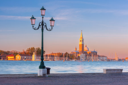 San Giorgio Maggiore island with church and marina seen from promenade in Venice Italyの写真素材