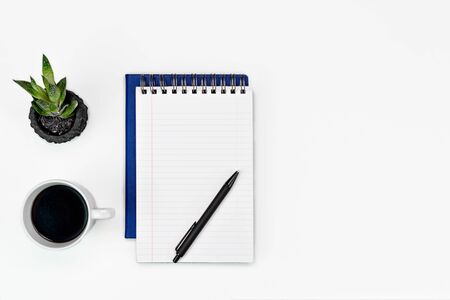White office desk table layout. glasses, coffee and office supplies. copy space flat layの写真素材