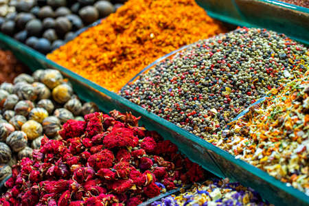 Various bright colored powder spices and fruit herbal tea and dryied vegetables on market in Istanbul, Turkeyの写真素材