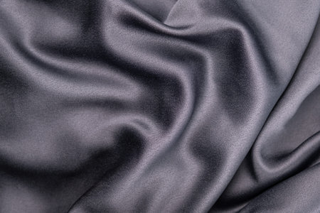 wavy rippled gray blue purple silk satin fabric backgroundの写真素材