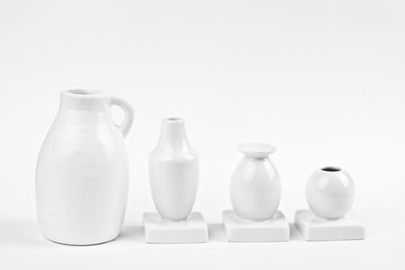 Decorative porcelain empty white vases on white backgroundの写真素材