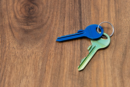 keys on wooden table background. rent sell buy apartment estate business