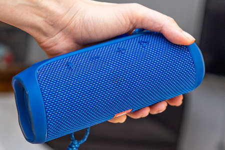 ISTANBUL, TURKEY - May, 2021: hand holding JBL Bluetooth music speaker marco close upのeditorial素材