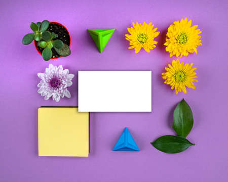 White paper card note bright flowers geometric composition mockup. greeting card. copy space, purple backgroundの写真素材