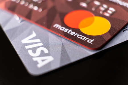 Mastercard and visa plastic electronic credit cards macro close up. ISTANBUL, TURKEY - February 2022のeditorial素材