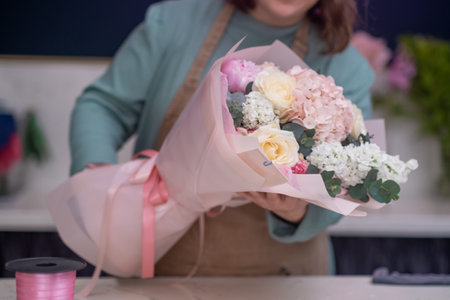 Welcome spring with a gorgeous bouquet of expertly arranged flowers from your local florist.の写真素材
