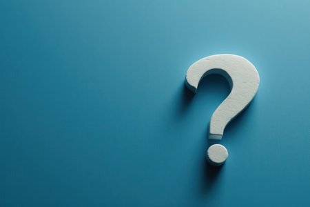 Bold white question mark on a blue background, creating a strong visual for concepts of doubtの素材