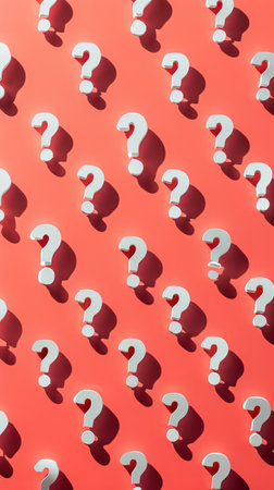 red background with white question marks with shadows , curiosity and the quest for answers.の素材