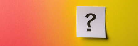 Question mark on a white canvas against a vibrant yellow and pink gradient background.の素材