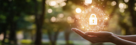 Glowing digital lock icon held in hands in a sunlit park, symbolizing online security and data protectionの素材